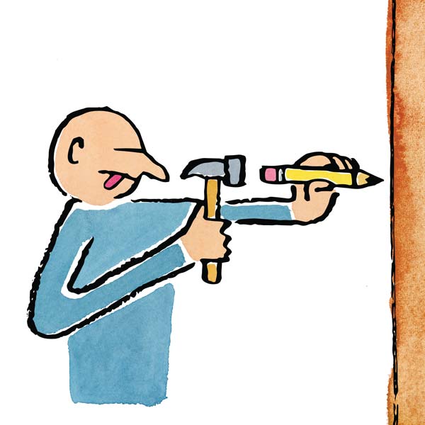 a person hammering a pencil into a tree