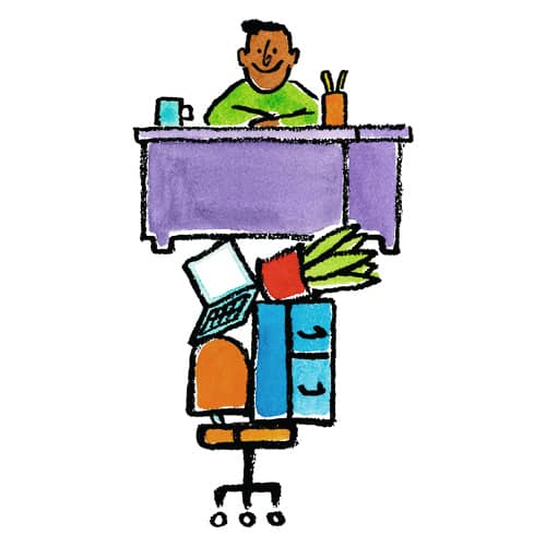 a person sitting at their desk that is on top of their chair